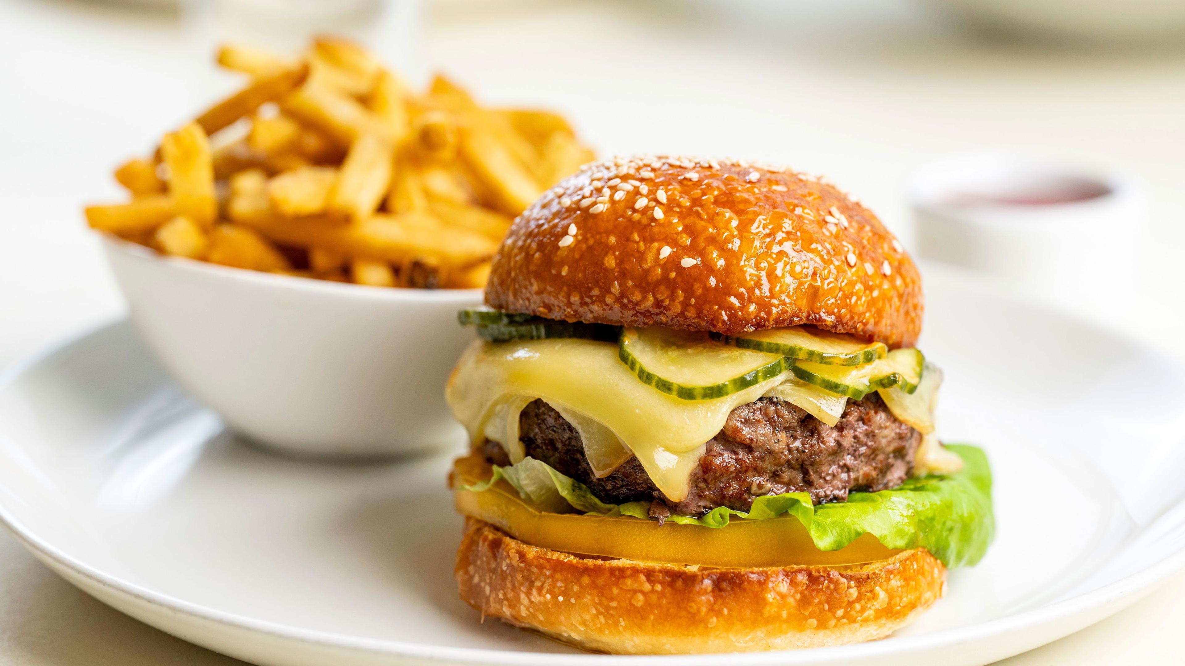 A burger with fries.