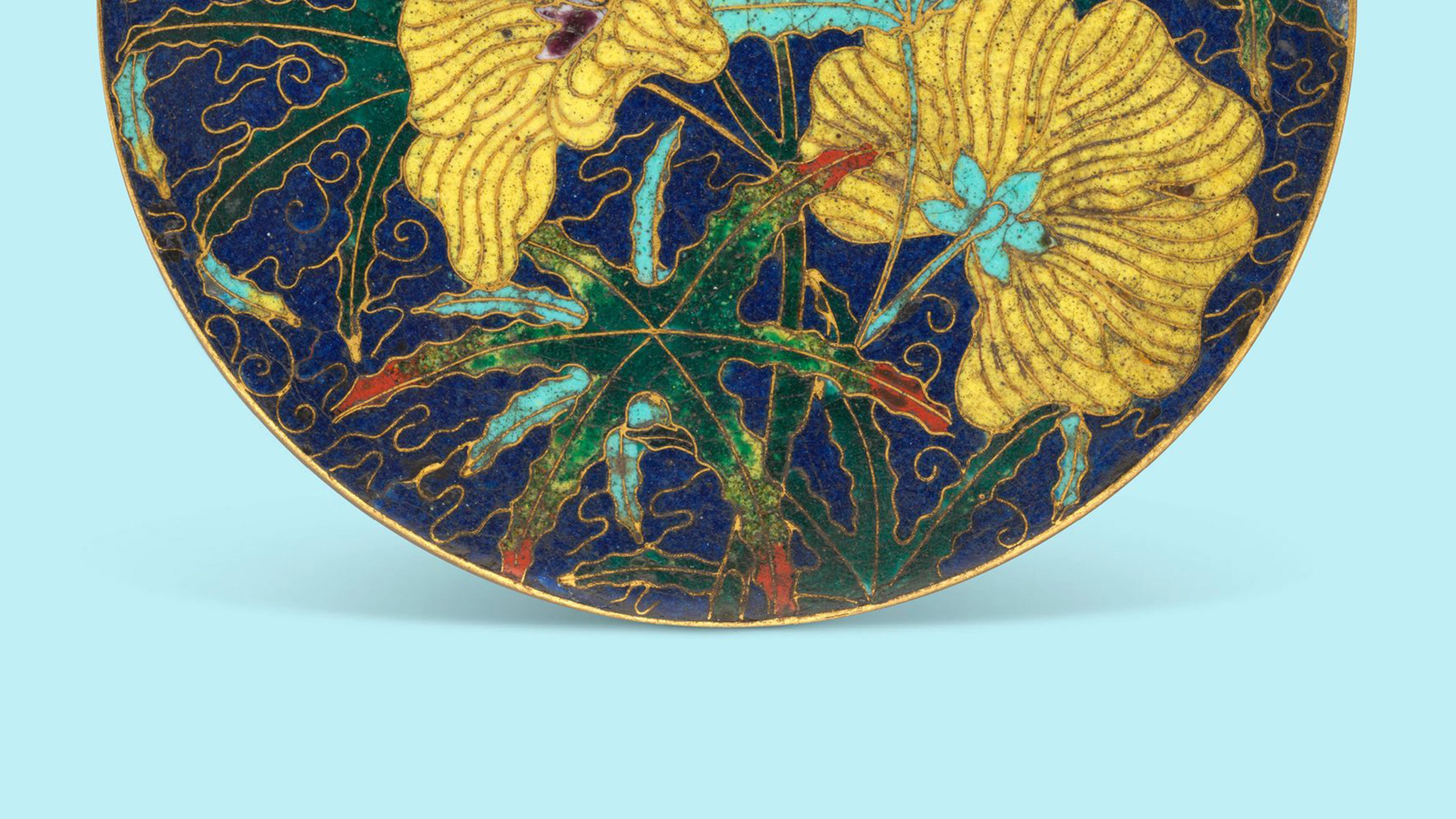 Design depicts yellow flowers with blue centers and green leaves on a deep blue background
