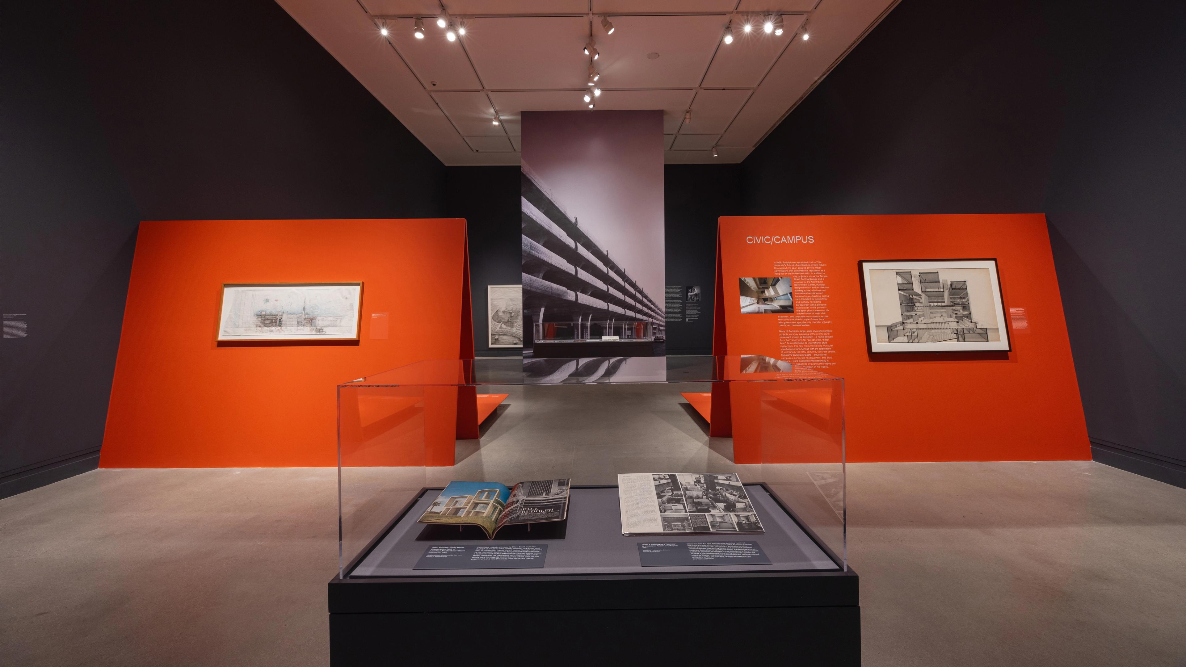 Display case of books within a larger exhibition