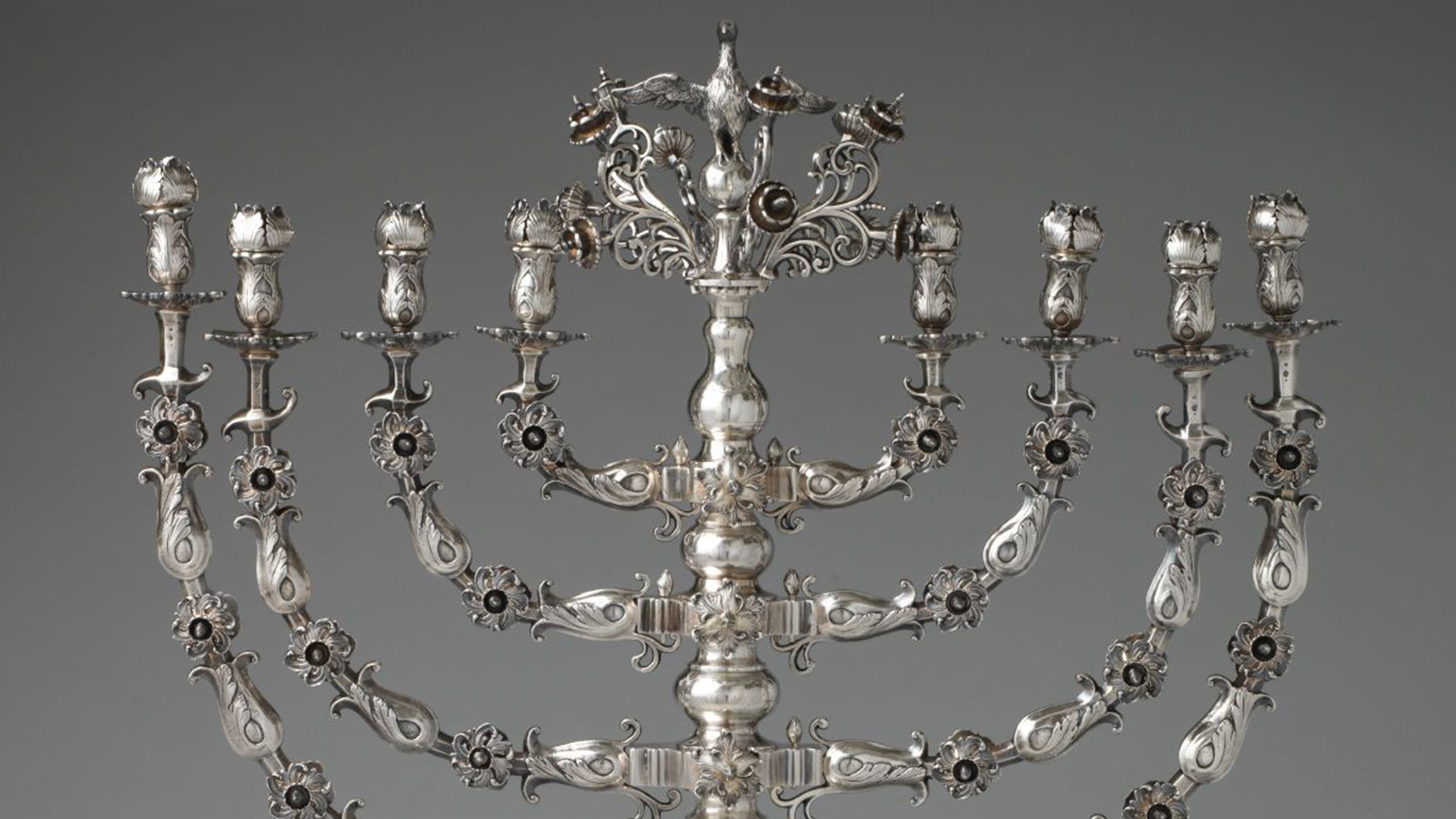 a close-up of an ornate silver menorah.